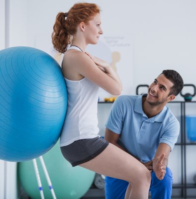 Physical Therapy Assistant helping a client